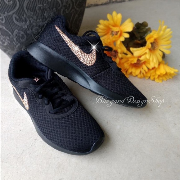black nike trainers with rose gold tick